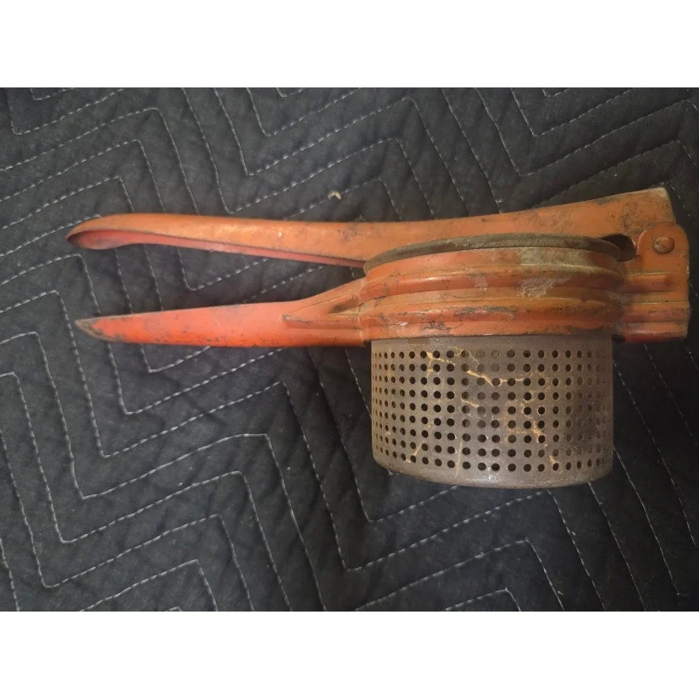 Vtg Orange Cast Metal Potato Ricer Fruit Press Hand Tool Rustic Kitchen Decor